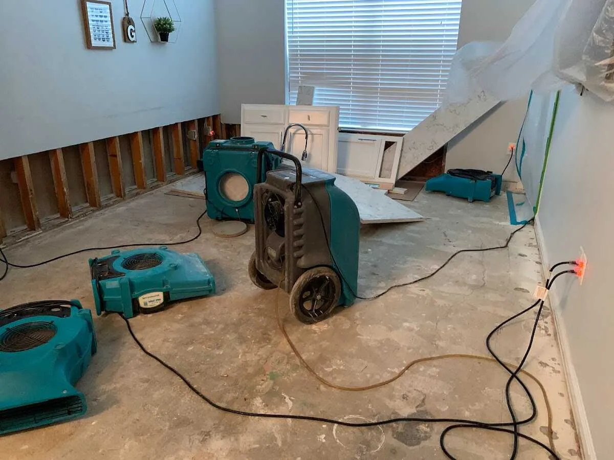 Dehumidifier in flood-cut room for Water Damage Restoration in Grafton